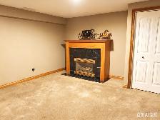 Bright and clean bedroom in Walk-out basement in Woodbine SW - Photo 2