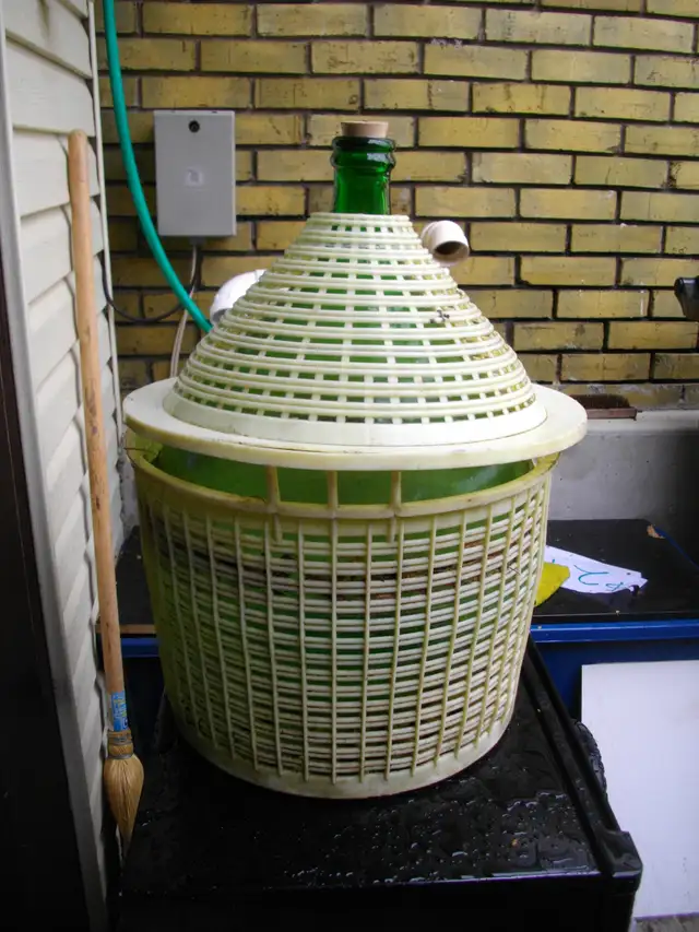 large green Italian carboy