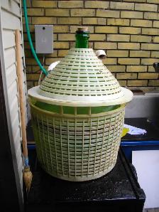 large green Italian carboy