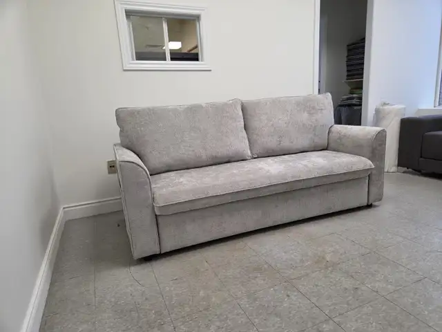 Grey Fabric Sofa Bed with Storage in Arms for only $699.
