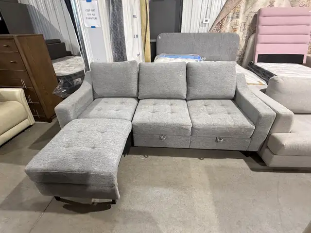 Grey fabric sofa with storage seats and fold out chaise