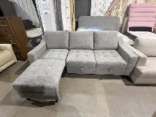 Grey fabric sofa with storage seats and fold out chaise