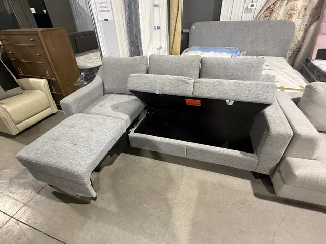 Grey fabric sofa with storage seats and fold out chaise - Photo 2