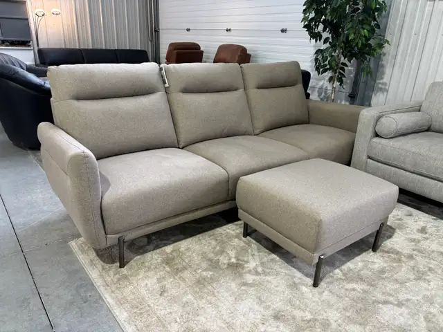 Brown fabric sofa with matching ottoman