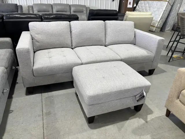 Light grey fabric sofa with matching ottoman