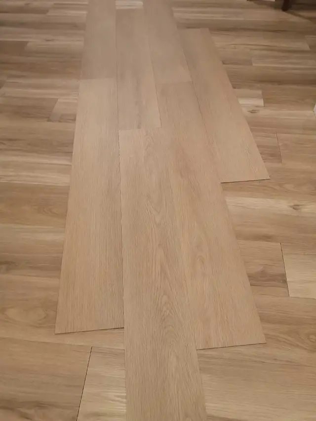 1044 sqft Oak coloured glue down LVP flooring W/glue - Photo 2