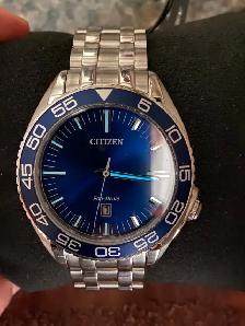 Brand new men’s Citizen Eco Drive blue dial 42 mm. $300