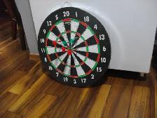 dart board with a few darts