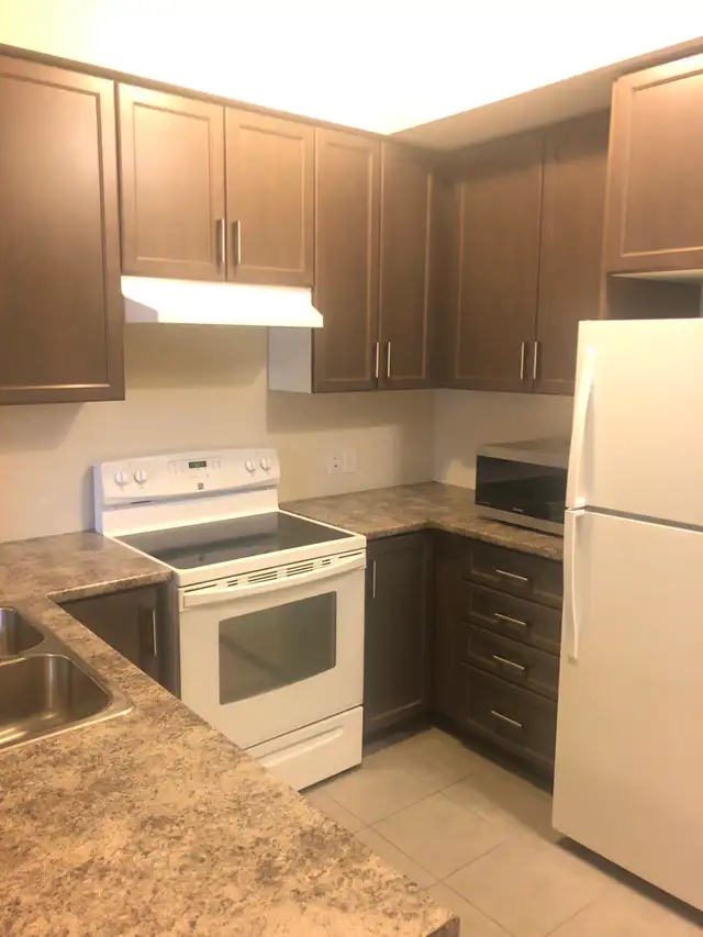 Spacious 3-Bedroom Condo with Balcony, Parking & Ensuite Laundry