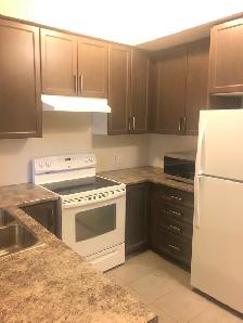 Spacious 3-Bedroom Condo with Balcony, Parking & Ensuite Laundry