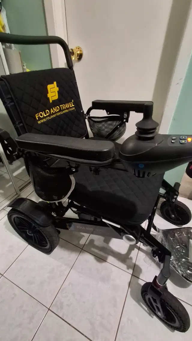 Electric wheelchair folding traveler