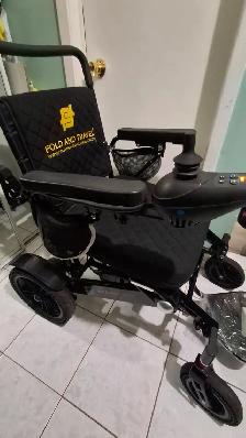 Electric wheelchair folding traveler