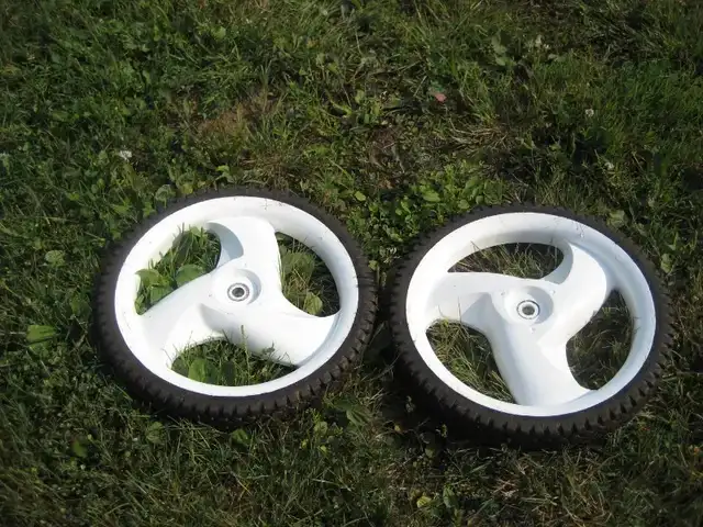 2 - 11 1/2 inch lawnmower wheels, used