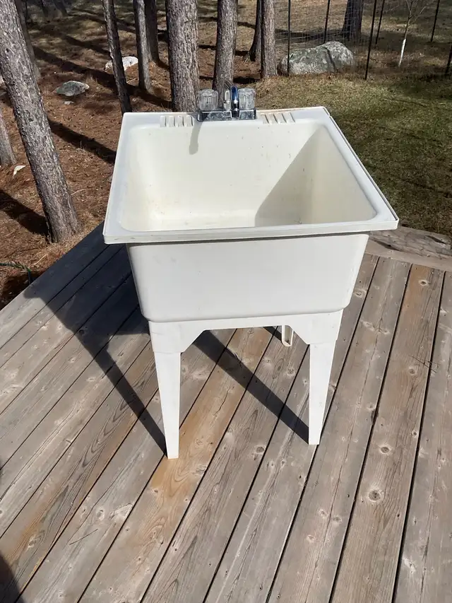 Laundry tub with tap