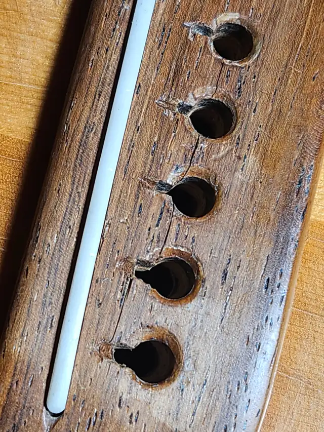 Bone nut and saddle replacement The Guitar Shoppe Calgary