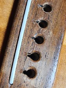 Bone nut and saddle replacement The Guitar Shoppe Calgary