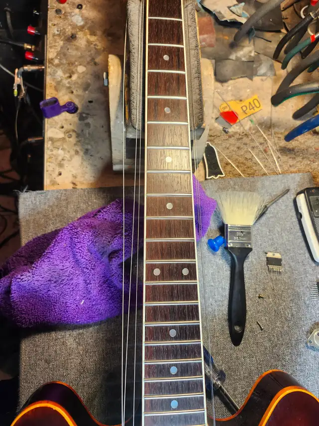 The Guitar Shoppe Calgary complete fret leveling - Photo 2
