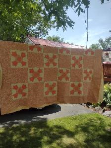 Peach coloured quilt with flowers 75 x 78