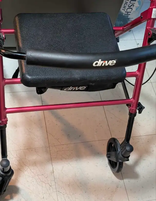 4 Wheeled walker with seat/storage basket
