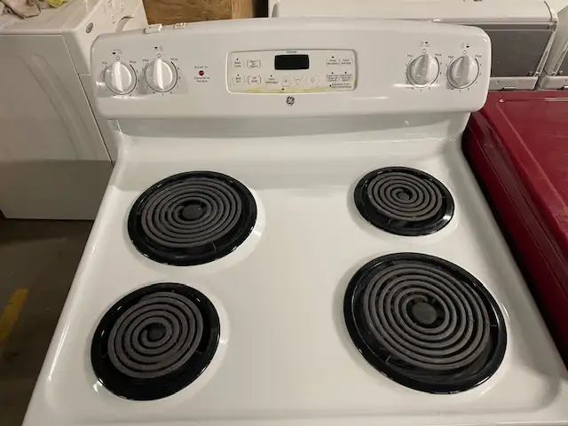 Cuisinière blanche ronds serpentins GE - Photo 2