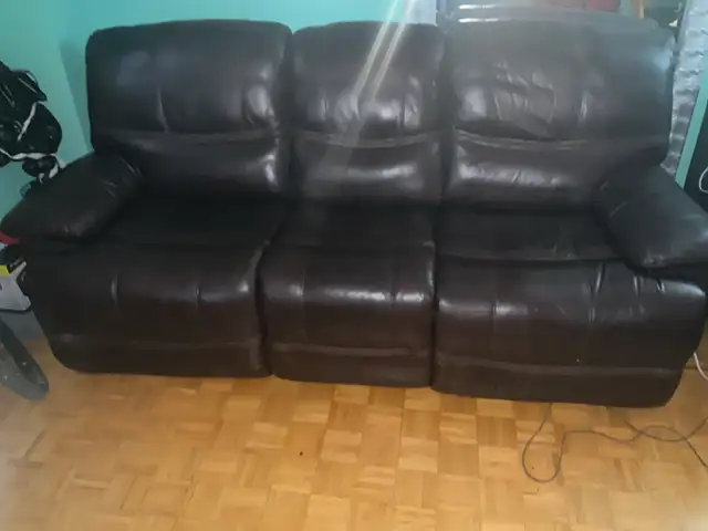 leather coach with two power recliners .