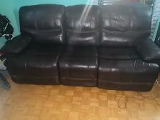 leather coach with two power recliners .