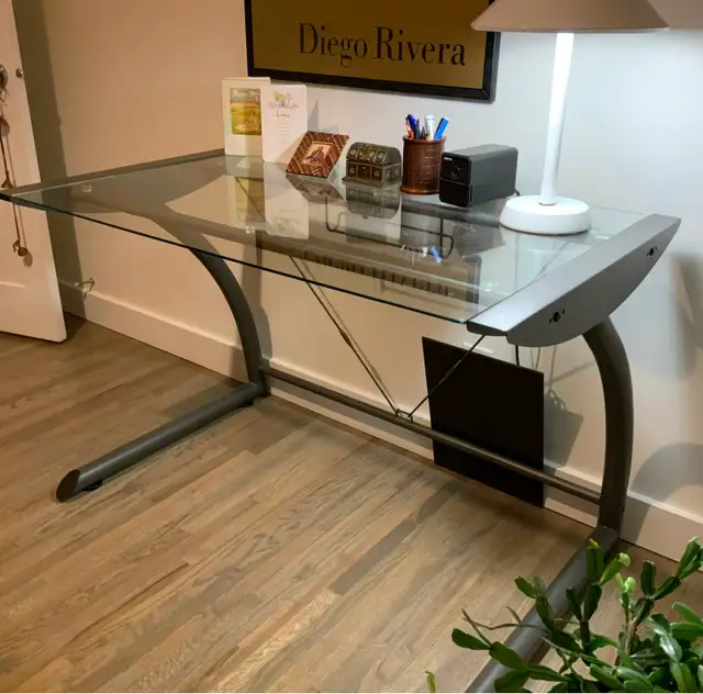 Desk, glass and steel, mint condition.  $25 West Calgary