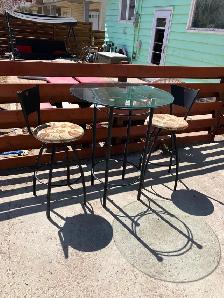 Bar height table with two chairs