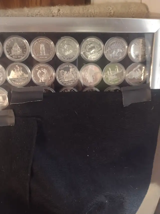 27 Canadian silver dollars all UNC. 1971 to 1997 beautiful coins