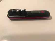 Brosse chauffante portative neuve
