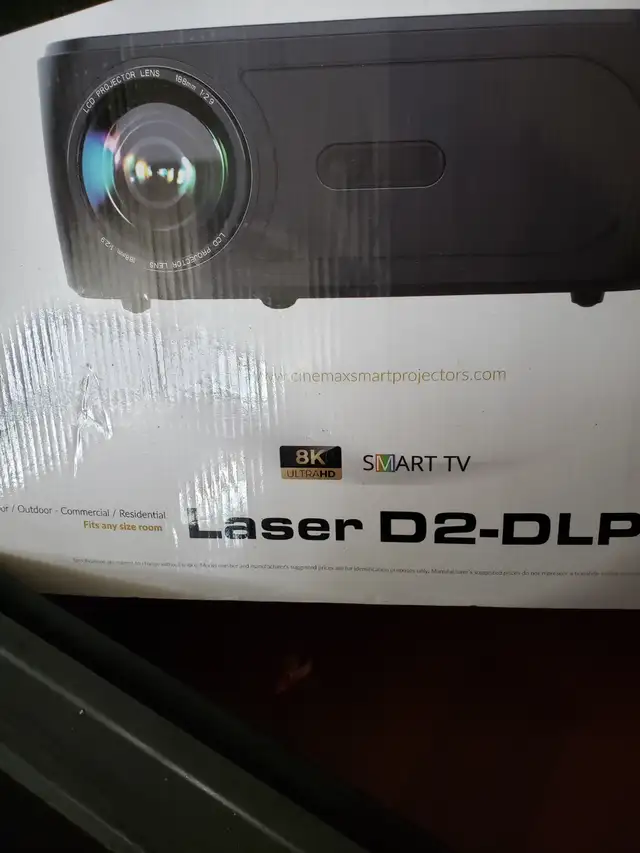 LASER D2-DLP 8K. PROJECTOR WITH REMOTE BOX,MENUAL IN EXC.COND.