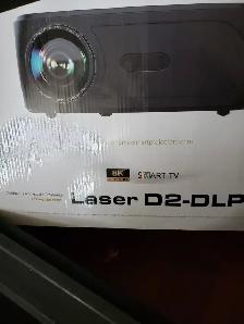 LASER D2-DLP 8K. PROJECTOR WITH REMOTE BOX,MENUAL IN EXC.COND.