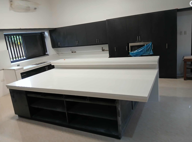 White Quartz Countertop - With Black Island - Photo 5