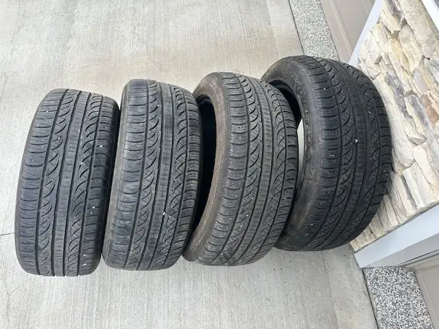 Free Pirelli P235/50ZR18 tires with 50% tread left.