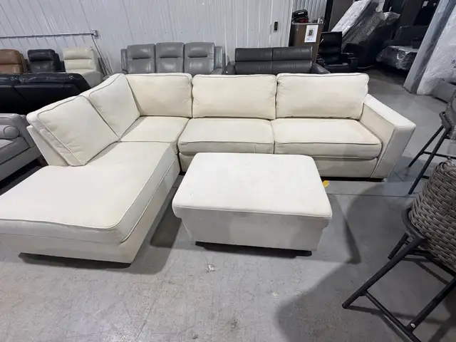 Cream fabric sectional with storage ottoman