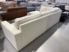 Cream fabric sectional with storage ottoman - Photo 3