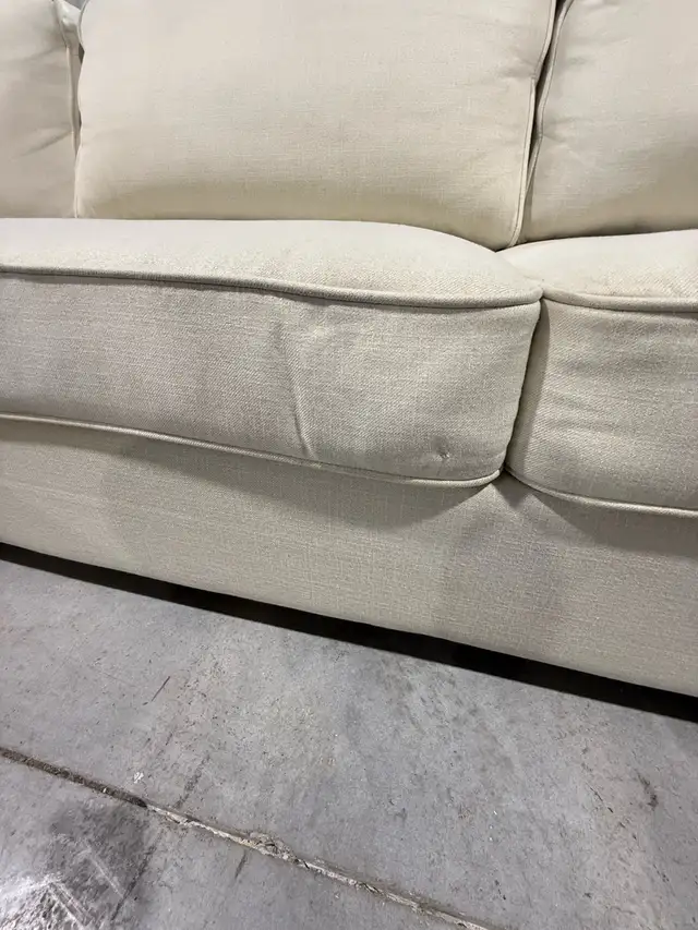Cream fabric sectional with storage ottoman - Photo 4