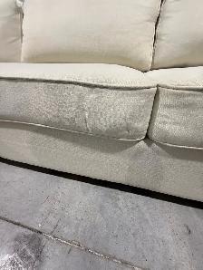 Cream fabric sectional with storage ottoman - Photo 4