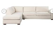Cream fabric sectional with storage ottoman - Photo 5