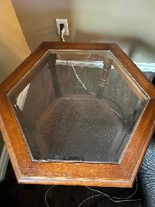 Hexagonal wooden end table with glass top and bottom shelf