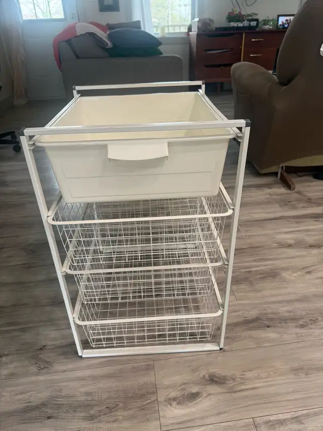 White storage unit with plastic bin and wire baskets