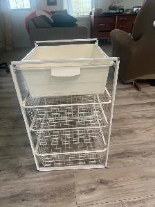 White storage unit with plastic bin and wire baskets