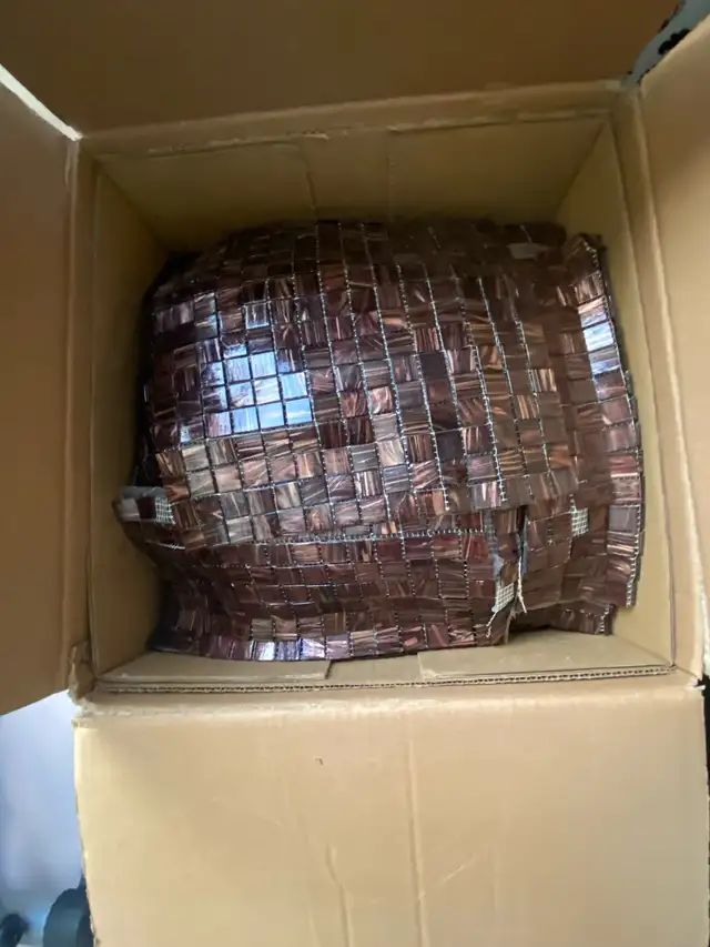 Brown backsplash never use in box weighs approximately 75 lbs