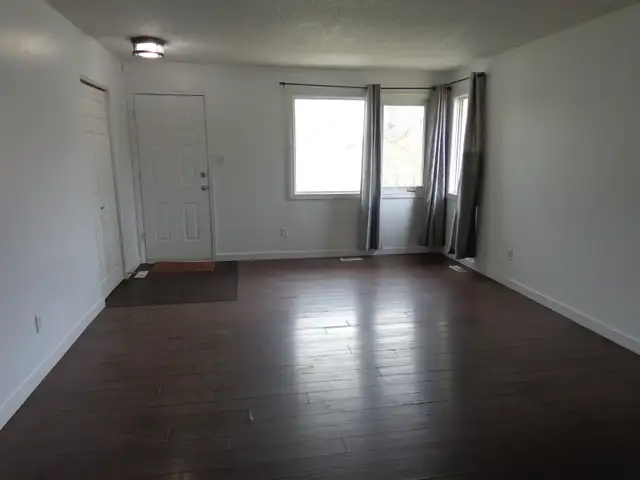 Open, bright 3-bedroom main-floor suite includes utilities