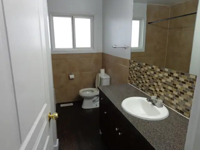 Open, bright 3-bedroom main-floor suite includes utilities - Photo 6