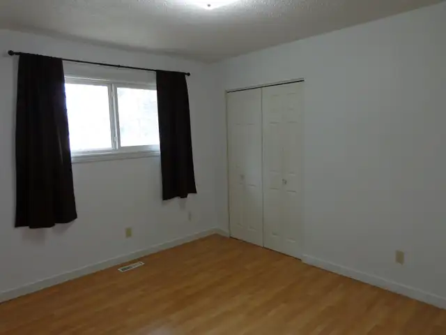 Open, bright 3-bedroom main-floor suite includes utilities - Photo 8