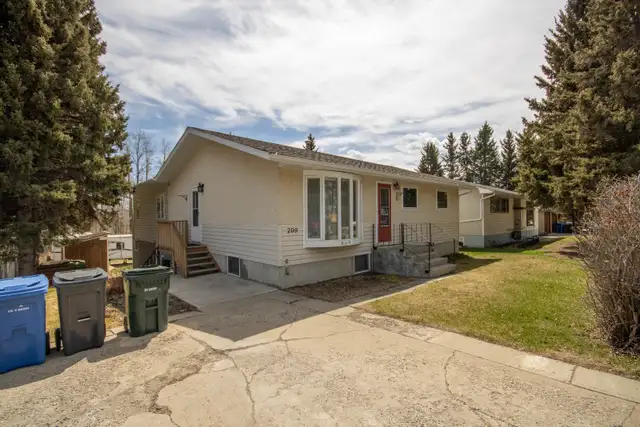 Bungalow for sale with Green space along the Red Deer River
