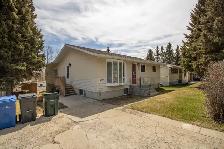 Bungalow for sale with Green space along the Red Deer River