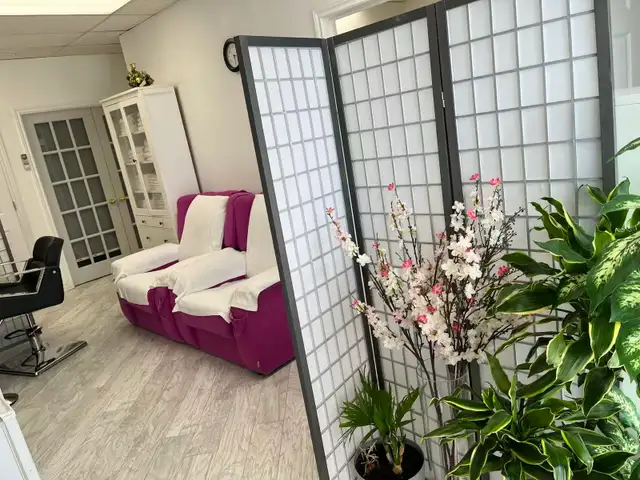 Female massage therapist experienced in body massage or facial
