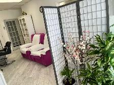 Female massage therapist experienced in body massage or facial